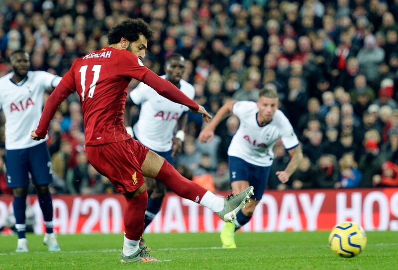 Mohamed Salah scores from the penalty spot against Tottenham to make the score 2-1 to Liverpool. EPA