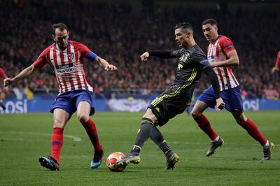 Atletico Madrid's Diego Godin attempts to block a shot from Cristiano Ronaldo of Juventus during the Champions League last-16 first-leg at the Wanda Metropolitano in February, 2019. Getty