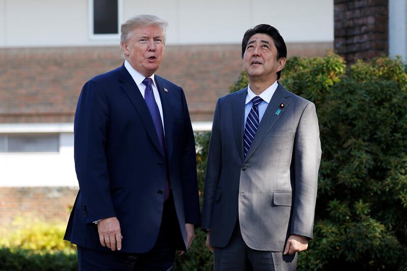 US president Donald Trump is greeted by Japan's prime minister Shinzo Abe at Kasumigaseki Country Club in Kawagoe, Japan. Jonathan Ernst / Reuters
