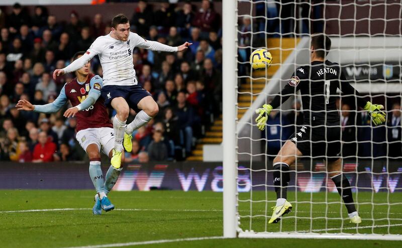 Liverpool's Andrew Robertson scores their equaliser against Aston Villa at Villa Park on Saturday. Reuters