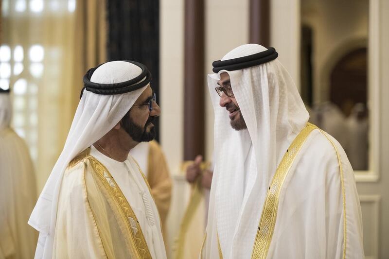 Sheikh Mohammed bin Rashid, Vice President and Ruler of Dubai, speaks with Sheikh Mohammed bin Zayed, Crown Prince of Abu Dhabi and Deputy Supreme Commander of the Armed Forces, during an Eid Al Adha reception at Mushrif Palace. Ryan Carter / Crown Prince Court – Abu Dhabi