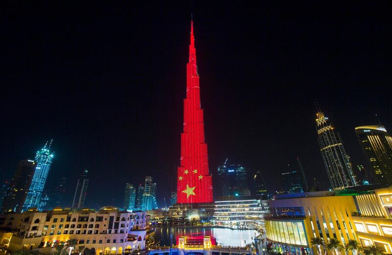 DUBAI, UNITED ARAB EMIRATES, 17 JULY 2018 -Burj Khalifa lighting up in Chinese flag to mark Chinese president’s visit to the UAE this week.  Leslie Pableo for The National