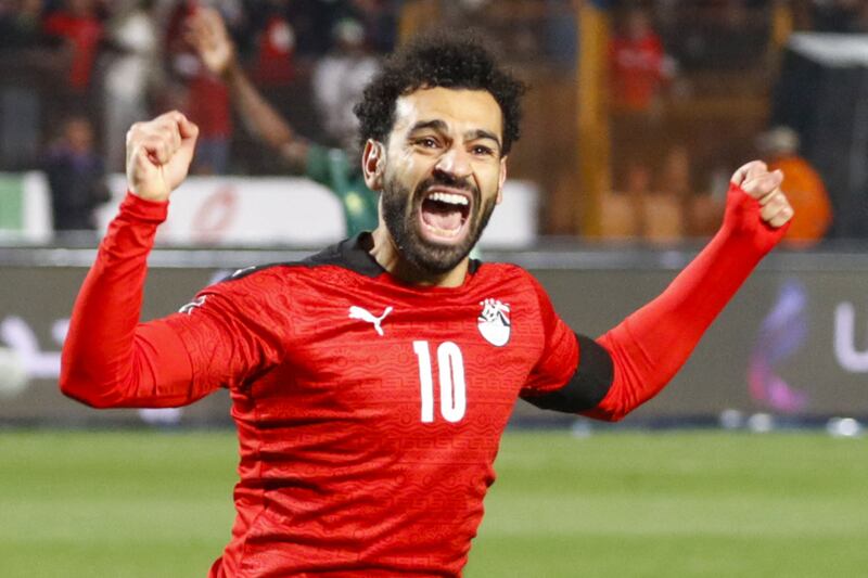 Egypt's Mohamed Salah celebrates after scoring during the  World Cup 2022 qualifier against Senegal at Cairo International Stadium on Friday, March 25, 2022. AFP