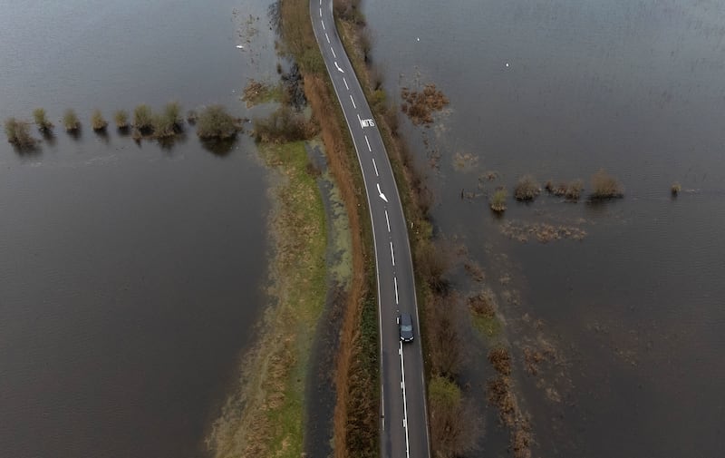 The A1101 in Welney on the Cambridgeshire-Norfolk border, where the River Delph and New Bedford River flooded the surrounding area. PA