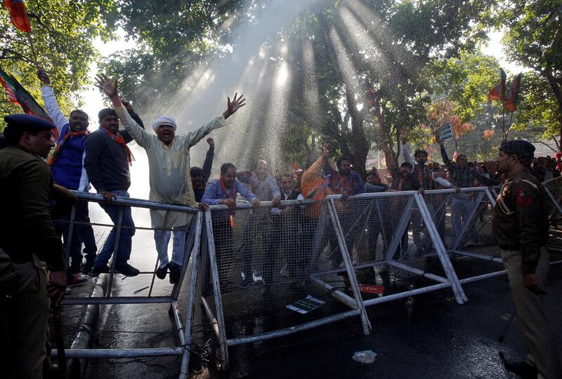 Supporters of India's ruling Bharatiya Janata Party  shout slogans during a protest against what they call 'disinformation' by India's main opposition Congress party on a deal to buy Rafale fighter planes from a French company, in Chandigarh, India. Reuters