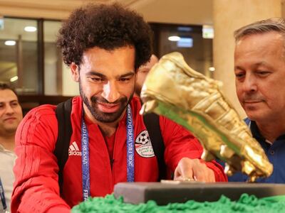 Mohamed Salah receives a 100kg birthday cake on arrival at a hotel in Grozny, Russia. AFP