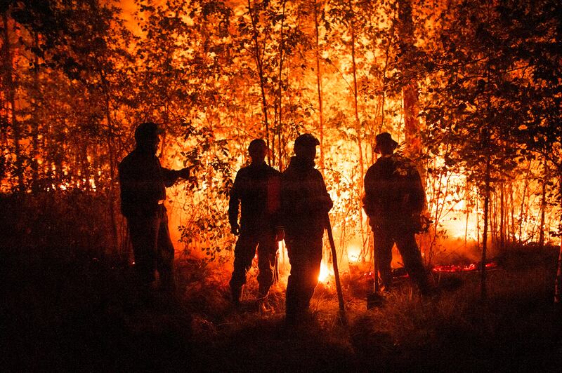 Forest fire near Kyuyorelyakh village, Russia. AP