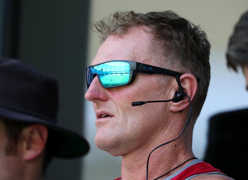 Dubai, United Arab Emirates - September 19, 2019: UAE coach Dougie Brown wearing a microphone to communicate with people on the field. UAE national team training match ahead of the World Cup T20 Qualifier next month. Thursday the 19th of September 2019. Dubai International stadium, Dubai. Chris Whiteoak / The National