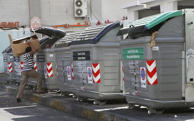Abu Dhabi is changing its waste collection policy to encourage residents to recycle. The new bins are black for non-recyclables and green bins for recyclables. Ravindranath K / The National