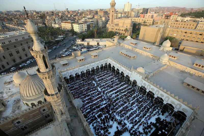 Muslim believers gather before breaking their fast at the Al Azhar mosque in Cairo. AFP