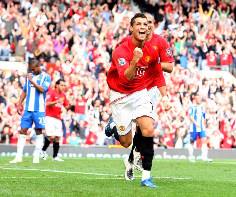 MANCHESTER, UNITED KINGDOM - OCTOBER 06:  Cristiano Ronaldo of Manchester United scores against Wigan Athletic during the Barclays Premier League match between Manchester United and Wigan Athletic at Old Trafford on October 06, 2007 in Manchester, England.  (Photo by Phil Cole/Getty Images)