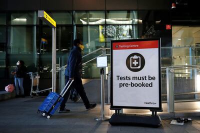 LONDON, ENGLAND - JANUARY 17: A traveler enters a testing centre at Heathrow Airport on January 17, 2021 in London, England. Tomorrow morning the UK will close its so-called "travel corridors" with countries from which arriving travelers were exempt from quarantine requirements. People flying into the UK will now be required to quarantine for 10 days unless they test negative for covid-19 after five days, or unless they qualify for a business-travel exemption. (Photo by Hollie Adams/Getty Images)