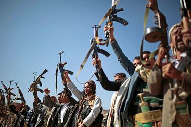 Tribesmen loyal to Houthi rebels hold up their weapons as they attend a gathering to show their support for the ongoing peace talks in Sanaa, Yemen. AP