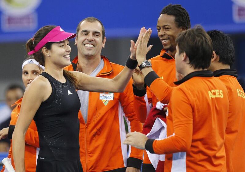 Indian Aces' Ana Ivanovic of Serbia celebrates with her teammates after beating UAE Royals' Kristina Mladenovic in their singles match at the IPTL on Saturday in Dubai. Ahmed Jadallah / Reuters