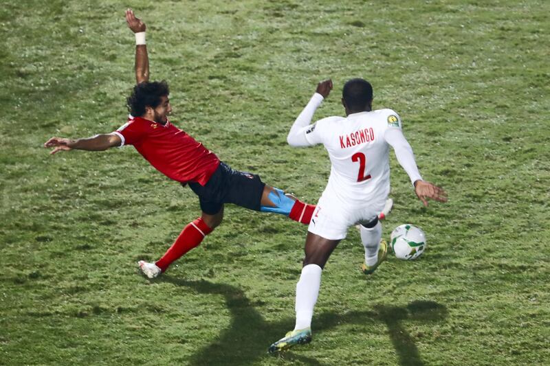 Ahly's defender Mohamed Hany (L) vies for the ball with Zamalek's forward Kabongo Kasongo during the CAF Champions League Final football match between Egyptian sides Zamalek and Al-Ahly at the Cairo International Stadium in Egypt's capital on November 27, 2020. (Photo by Khaled DESOUKI / AFP)