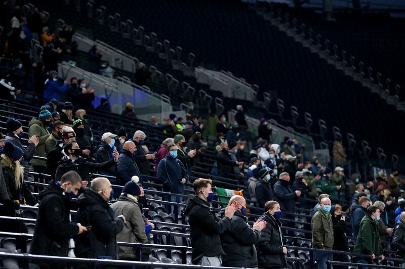 Fans in the stands prior to the beginning of the match at the Tottenham Hotspur Stadium. PA