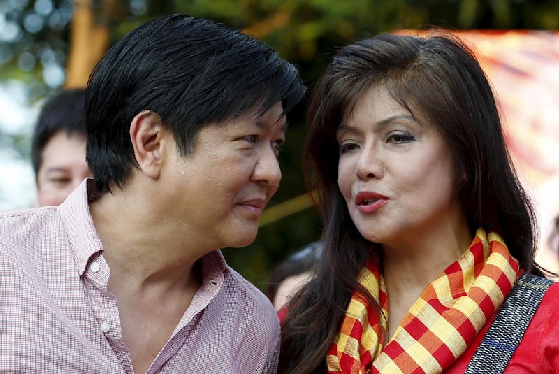 Vice Presidential candidate Ferdinand Marcos Jr (L) talks to his sister, Ilocos Norte Governor Imee Marcos during a political rally in Manila, October 10, 2015. Election season is under way in the Philippines and investors are in for a wild ride of power-politics dominated by entrenched family dynasties, whose machinations will leave little room for serious debate on badly needed reforms. The wife, son, daughter and nephew of late dictator Ferdinand Marcos will all run in the May 2016 elections, joining a host of other privileged candidates from elite families seeking to keep their hold on power in local and national politics. Picture taken October 10, 2015. REUTERS/Erik De Castro