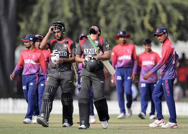 Dubai, United Arab Emirates - January 25, 2019: Amir Hayat and Imran Haider (R) of the UAE walk off after winning the game in the the match between the UAE and Nepal in a one day internationl. Friday, January 25th, 2019 at ICC, Dubai. Chris Whiteoak/The National