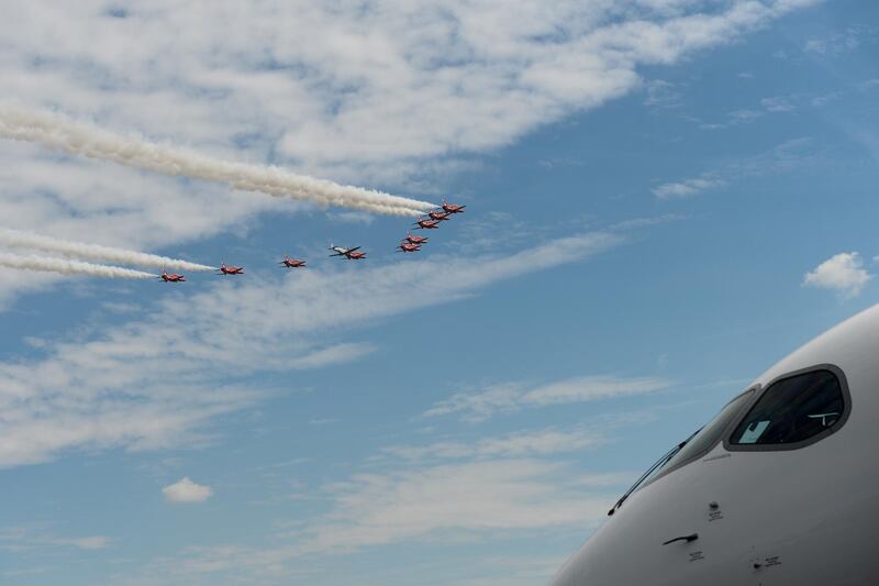 The British Royal Air Force's Red Arrows aerobatic demonstration team perform a flypast. Bloomberg