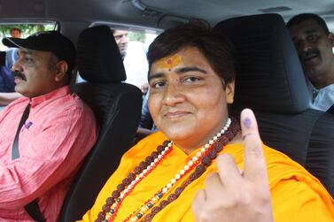 Pragya Singh Thakur, an election candidate for India's ruling Bharatiya Janata Party, shows her ink-marked finger after voting in Bhopal on May 12, 2019. Reuters