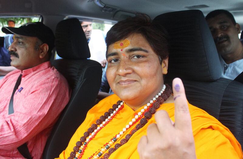 Pragya Singh Thakur, leader of ruling Bharatiya Janata Party (BJP), shows her ink-marked finger after casting her vote, outside a polling station in Bhopal, India, May 12, 2019. REUTERS/Raj Patidar