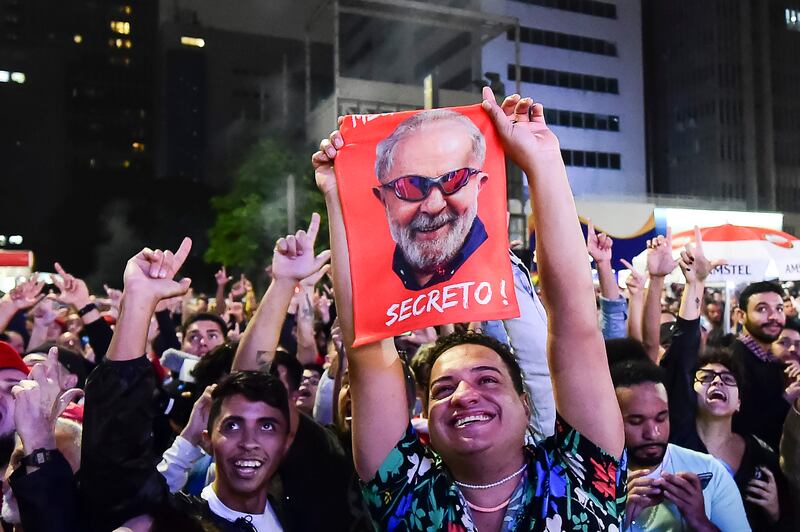 Jubilant Lula supporters in Sao Paulo. But rival Mr Bolsonaro will also take heart from the result, having been written off by many pollsters. Getty 
