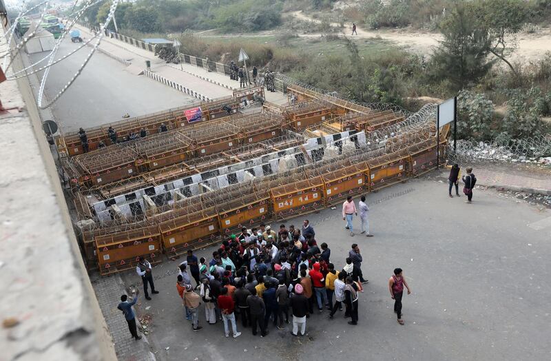 Protesting farmers encounter barbed wire and barricades placed by security personnel at the Delhi Ghazipur Border, near New Delhi, India. EPA