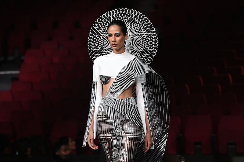 Models present creations by designer Amit Aggarwal during the FDCI India Couture Week in New Delhi on July 30, 2022.  All photos: AFP