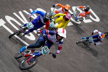 Bethany Shriever of Britain, center, who won gold, is followed by Axelle Etienne of France, left, in the women's BMX Racing semifinals at the 2020 Summer Olympics, Friday, July 30, 2021, in Tokyo, Japan.  (AP Photo / Ben Curtis)