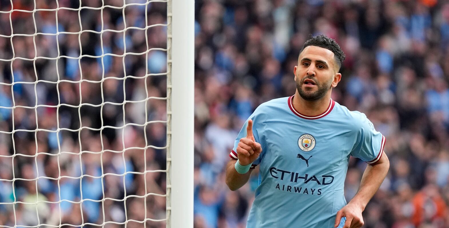 Manchester City's Riyad Mahrez celebrates after scoring his side's second goal during the English FA Cup semi final soccer match between Manchester City and Sheffield United at Wembley stadium, in London, Saturday, April 22, 2023.  (AP Photo / Alastair Grant)