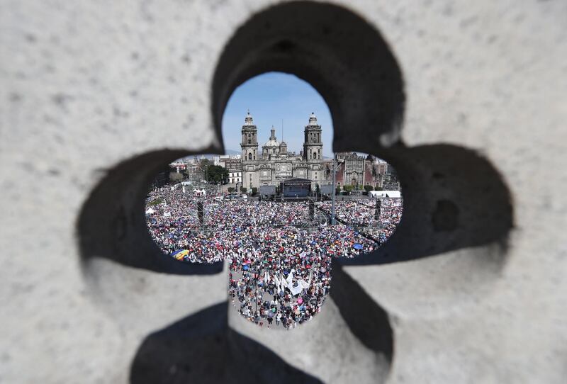 President of Mexico Andres Manuel Lopez Obrador and his wife Beatriz Gutierrez Muller address the public during the presentation of the First Government Report in the Zocalo of Mexico City.  EPA