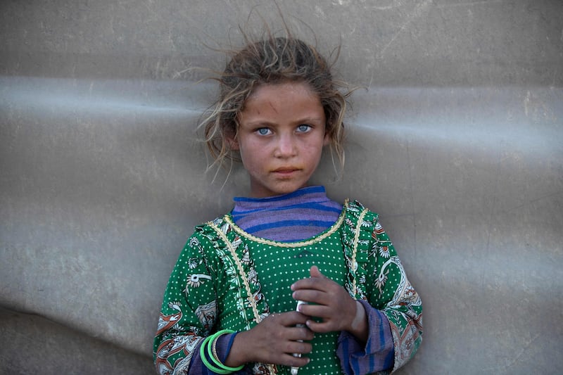 A girl at a camp for Syrians displaced by conflict near the northern city of Raqa. AFP