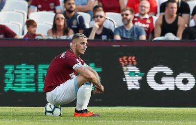 Soccer Football - Premier League - West Ham United v Wolverhampton Wanderers - London Stadium, London, Britain - September 1, 2018  West Ham's Marko Arnautovic sits on a ball during the match                     REUTERS/David Klein  EDITORIAL USE ONLY. No use with unauthorized audio, video, data, fixture lists, club/league logos or "live" services. Online in-match use limited to 75 images, no video emulation. No use in betting, games or single club/league/player publications.  Please contact your account representative for further details.