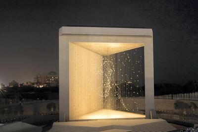 The Founder's Memorial lit up at night on the Corniche