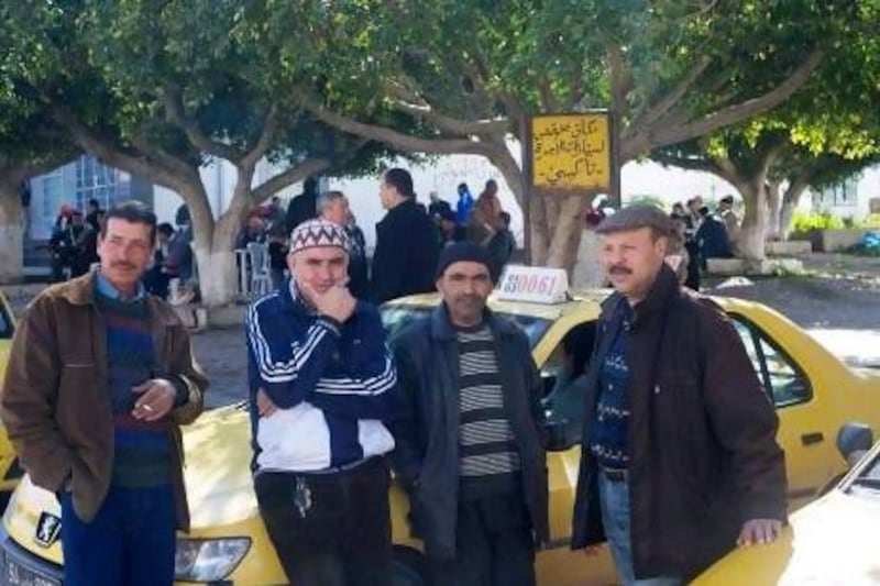 Taxi drivers wait for customers in Mateur, an industrial town near Tunis gripped last week by a labour strike and rioting.