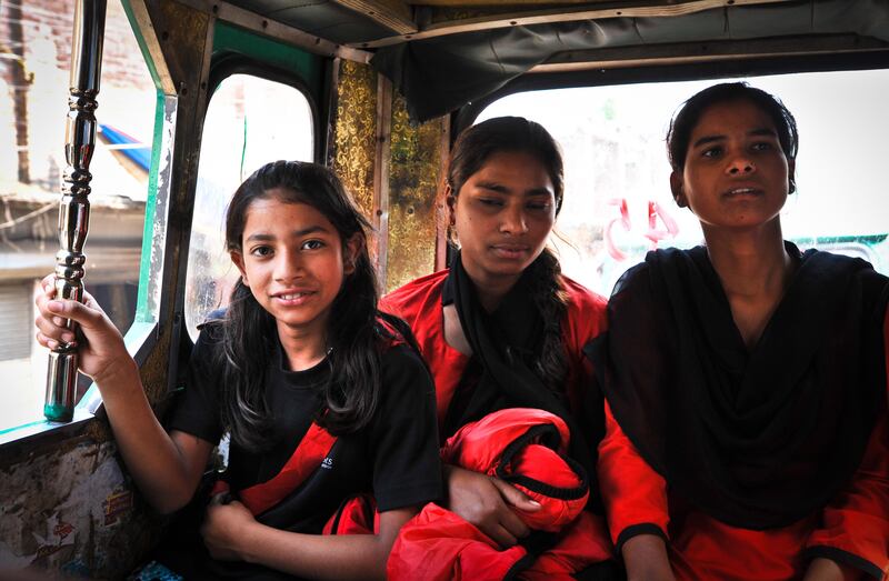 Nargis, 11, the youngest member of the Red Brigade,(left) with other members of the group in a taxi on the way back from martial arts training in Lucknow. The Red Brigade was formed in November 2010 to fight back against a growing number of sexual attacks on women in the Madiyav area of the city of Lucknow, in Uttar Pradesh state, India.
The group of young women wear distinctive red and black salwar kameez. Most have been victims of sexual assault and have resolved that they will take no more. They take direct action against their tormentors and now when a local man steps out of line, he can expect a visit from the Red Brigade and a thrashing.