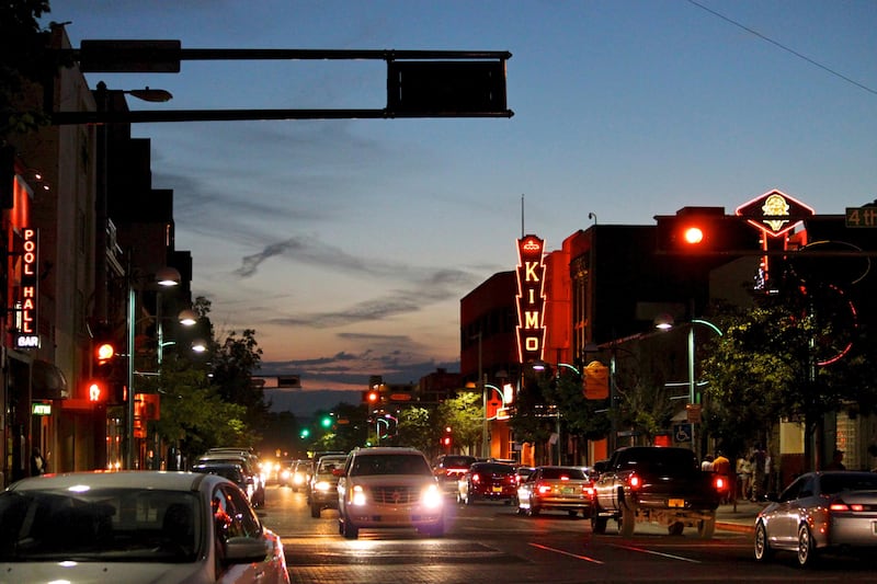 FILE - In this June 21, 2016, file photo, cars make their way along historic Route 66 in downtown Albuquerque, N.M. Albuquerque is one of the cities wooing Amazon to build their second headquarters in their area. (AP Photo/Susan Montoya Bryan, File)