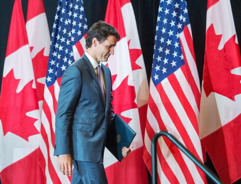 Canada's Prime Minister Justin Trudeau leaves the stage after his press conference at the National Governors Association special session called "Collaborating to Create Tomorrow's Global Economy," Friday, July 14, 2017, in Providence, R.I.  (Ryan Remiorz/The Canadian Press via AP)