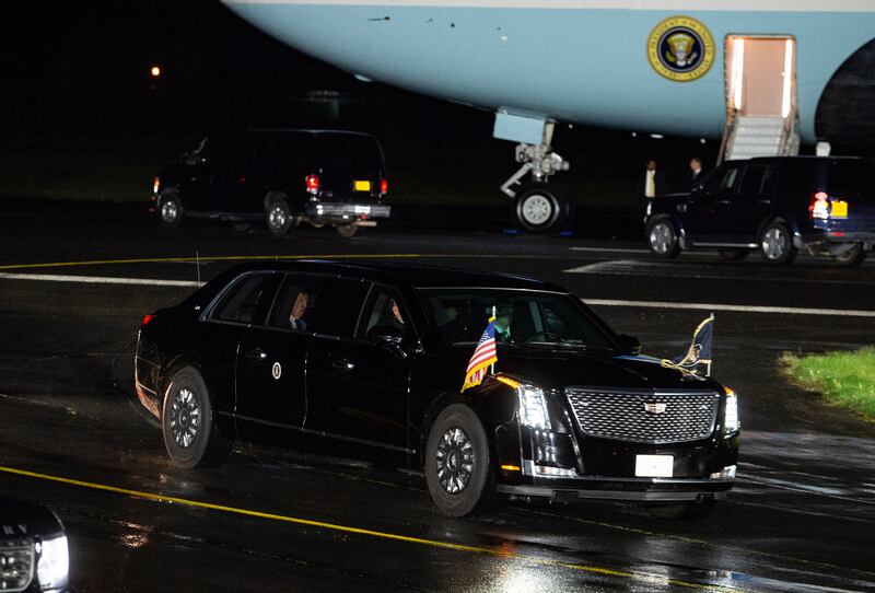 The US car known as The Beast carries Mr Biden away from RAF Aldergrove on Tuesday. AP