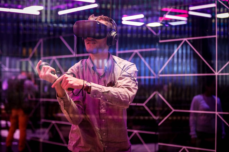 A user tries out the Oculus Quest virtual reality gaming system at the Facebook F8 Conference in San Jose, California. AFP