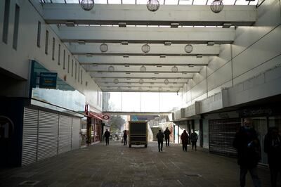 COVENTRY, ENGLAND - NOVEMBER 23: People walk through a shopping centre on November 23, 2020 in Coventry, England. Coventry won a quadrennial competition held by Britain's Department of Digital, Culture, Media & Sport to celebrate a city's cultural scene, highlighting its music, dance and theatrical events. Thankfully, Coventry's year in the spotlight begins May 2021, when the UK -- and much of the rest of the world -- hopes to have seen the live-events industry fully rebound from the covid-19 pandemic. Previous winners of the competition are Derry/Londonderry in 2013 and Hull in 2017. (Photo by Christopher Furlong/Getty Images)