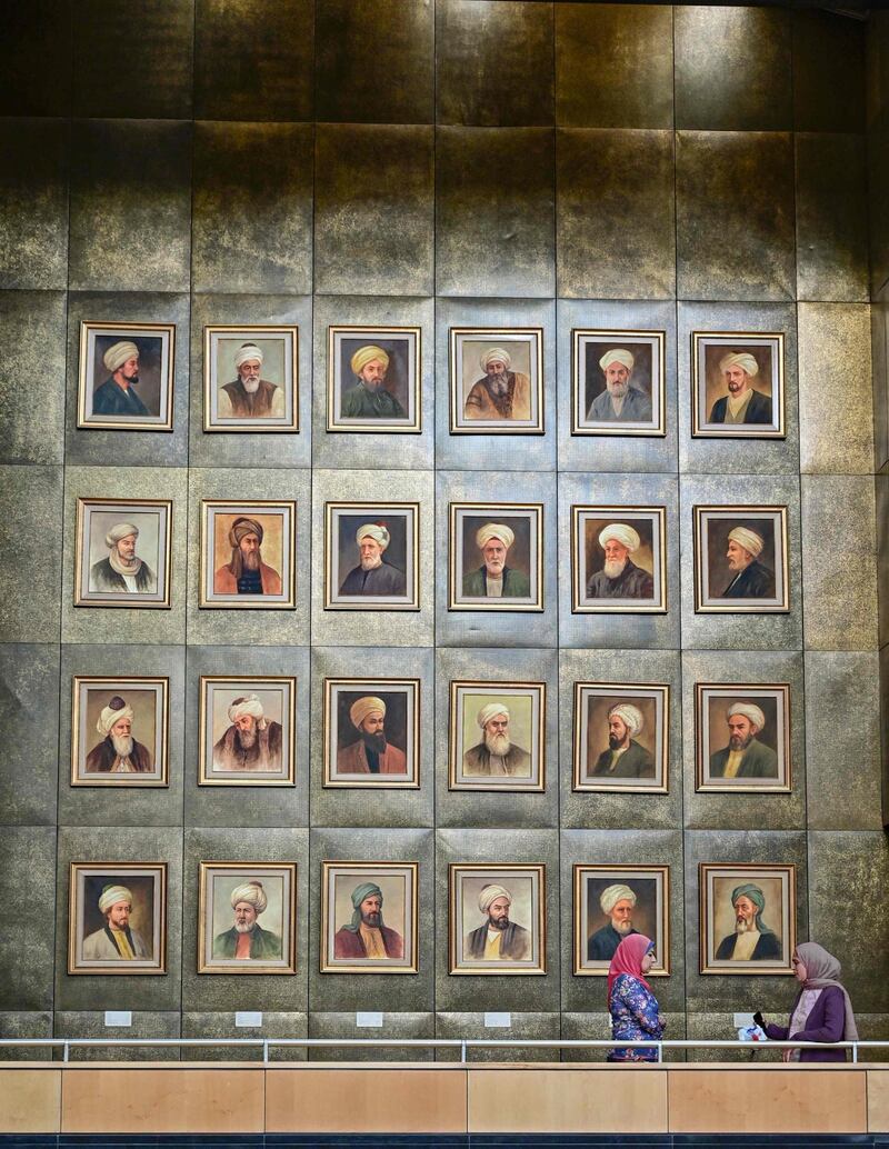A view of a wall showing the portraits of medieval scholars hanging inside the main building of the Bibliotheca Alexandrina library in Egypt's northern coastal city of Alexandria. AFP