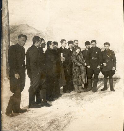 Group photo of the dispatchers for the Kolyma motorway. Russian artist Xenia Nikolskaya's grandfather is fourth from the right, behind the woman in the fur coat. The man on the far right with the rifle is clearly an NKVD officer. This rare photo offers an inkling of what life was like in Kolyma circa 1940. 
