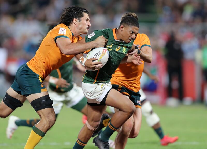 South Africa's Shilton van Wyk is tackled during the Dubai Sevens final.