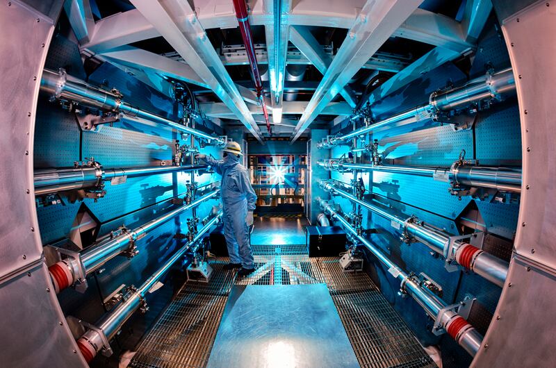 A technician reviews an optic inside the preamplifier support structure at the Lawrence Livermore National Laboratory in Livermore, California. AP