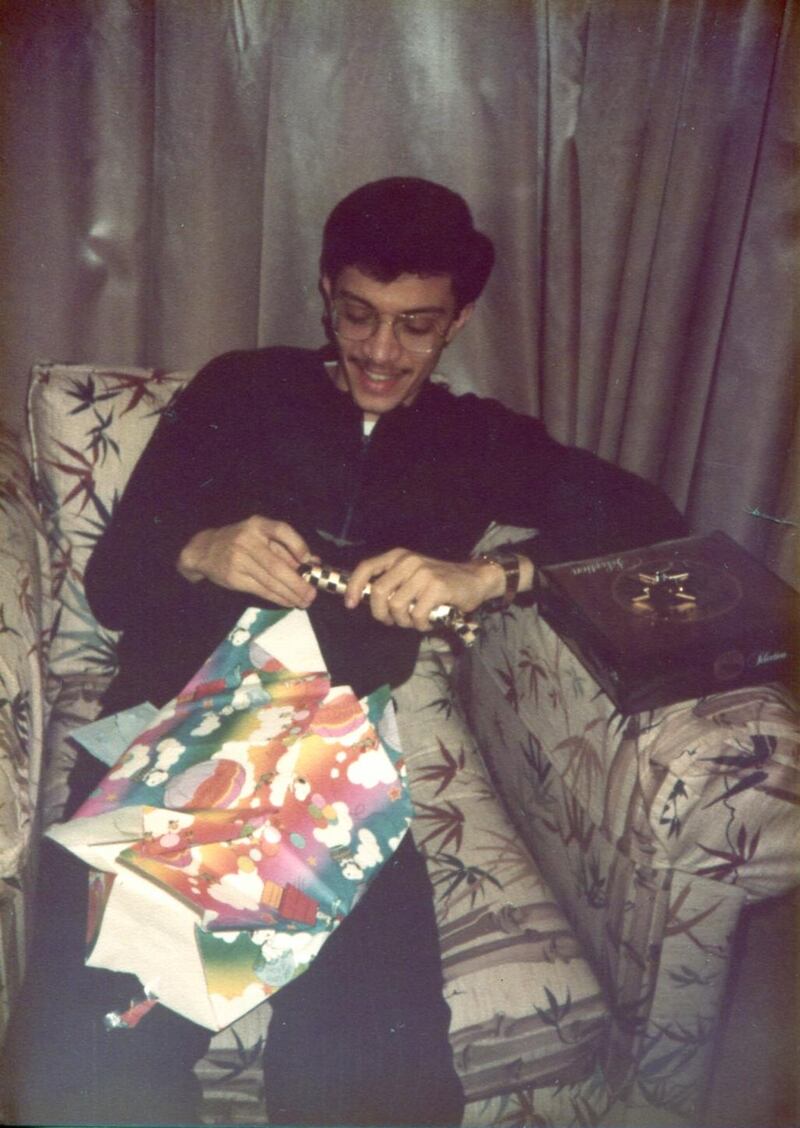 Adel Alkaff Al Hashmi opening a gift sent to his London home by his mother in Abu Dhabi for the Eid holiday.