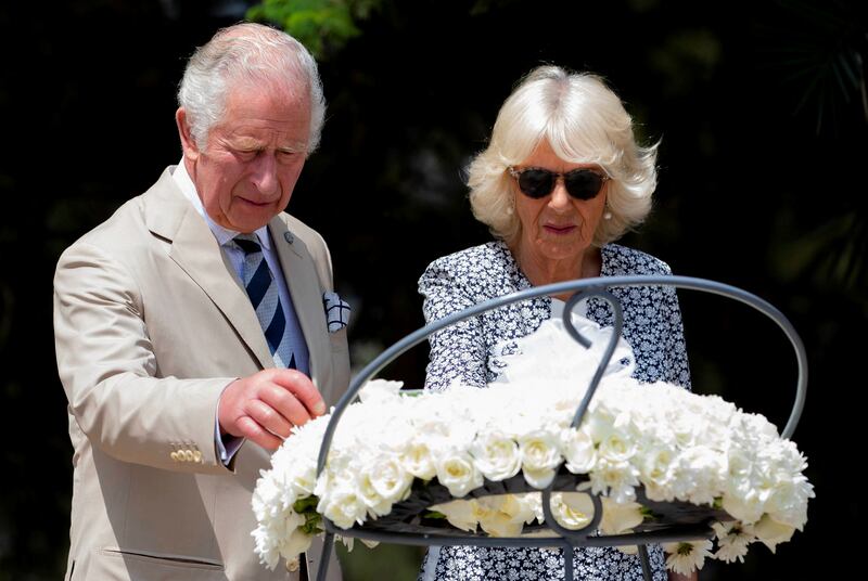 Britain's Prince Charles and his wife Camilla, Duchess of Cornwall lay a wreath on a mass grave containing the remains of victims of the 1994 Rwandan genocide at the Genocide Memorial Centre at Gisozi in Kigali. Reuters
