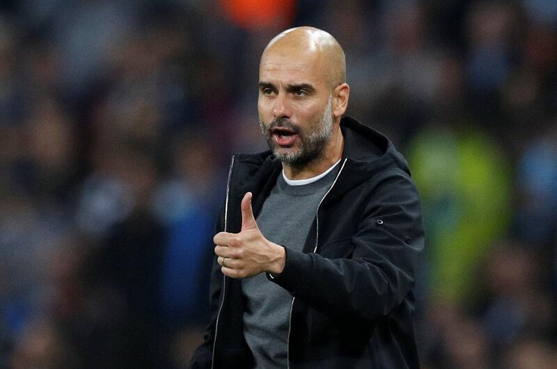 Manchester City manager Pep Guardiola gives his approval from the touchline. Phil Noble / Reuters