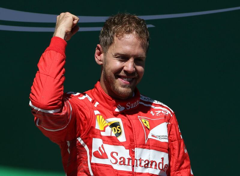 Formula One F1 - Brazilian Grand Prix 2017 - Sao Paulo, Brazil - November 12, 2017  Ferrari's Sebastian Vettel celebrates winning the race on the podium  REUTERS/Paulo Whitaker