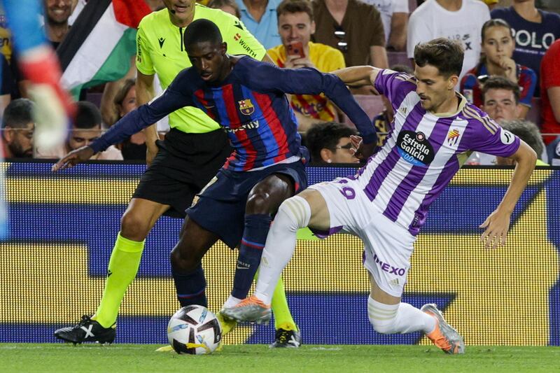 Barcelona winger Ousmane Dembele takes on Real Valladolid midfielder Toni Villa. EPA